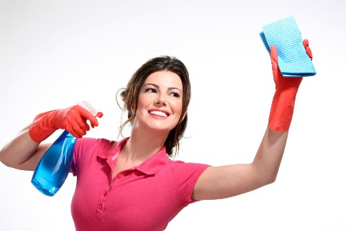 Technician vacuuming a mattress for allergen control